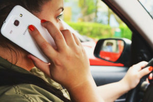 Woman Using Cellphone in the Car — Fayetteville, NC — Britt Carl L Jr