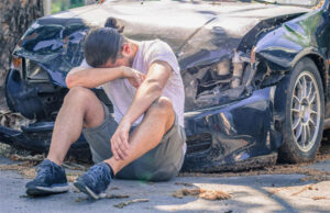 Man Crying on Damaged Auto After Car Crash — Fayetteville, NC — Britt Carl L Jr