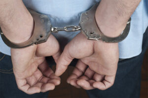 A Bans Hands in Handcuffs Behind His Back — Fayetteville, NC — Britt Carl L Jr