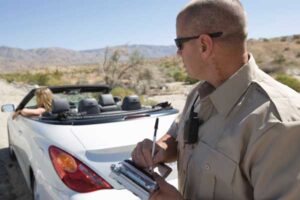 Police Officer Checking on Driver in Desert — Fayetteville, NC — Britt Carl L Jr